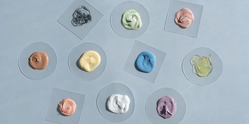 Technician monitoring scale-up parameters during cosmetic manufacturing
