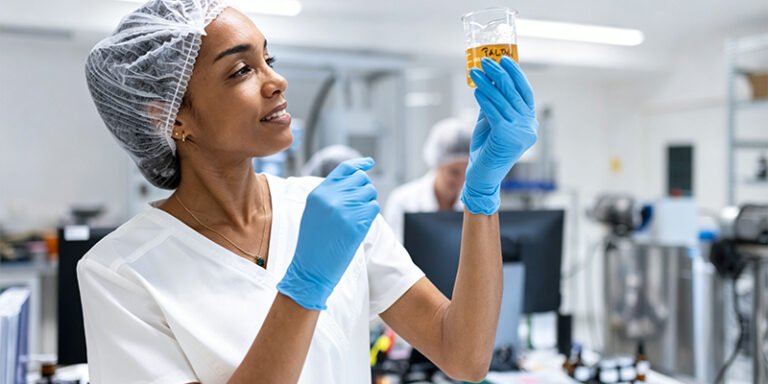 Laboratory technician performing microbiological testing for cosmetic quality control